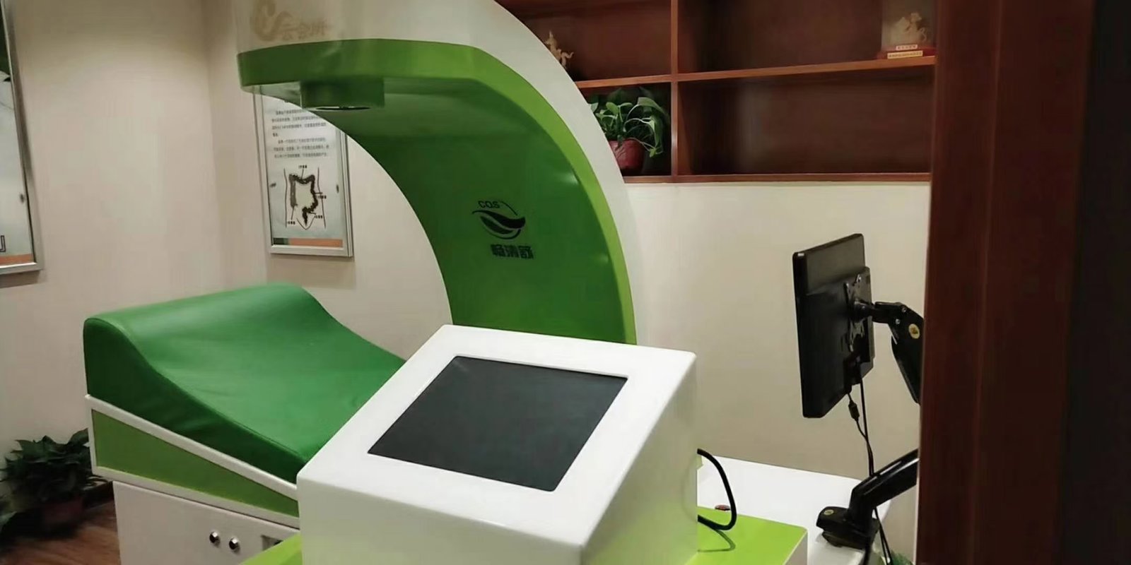 UK spa owner reviewing colonic machine OEM branding options on tablet
