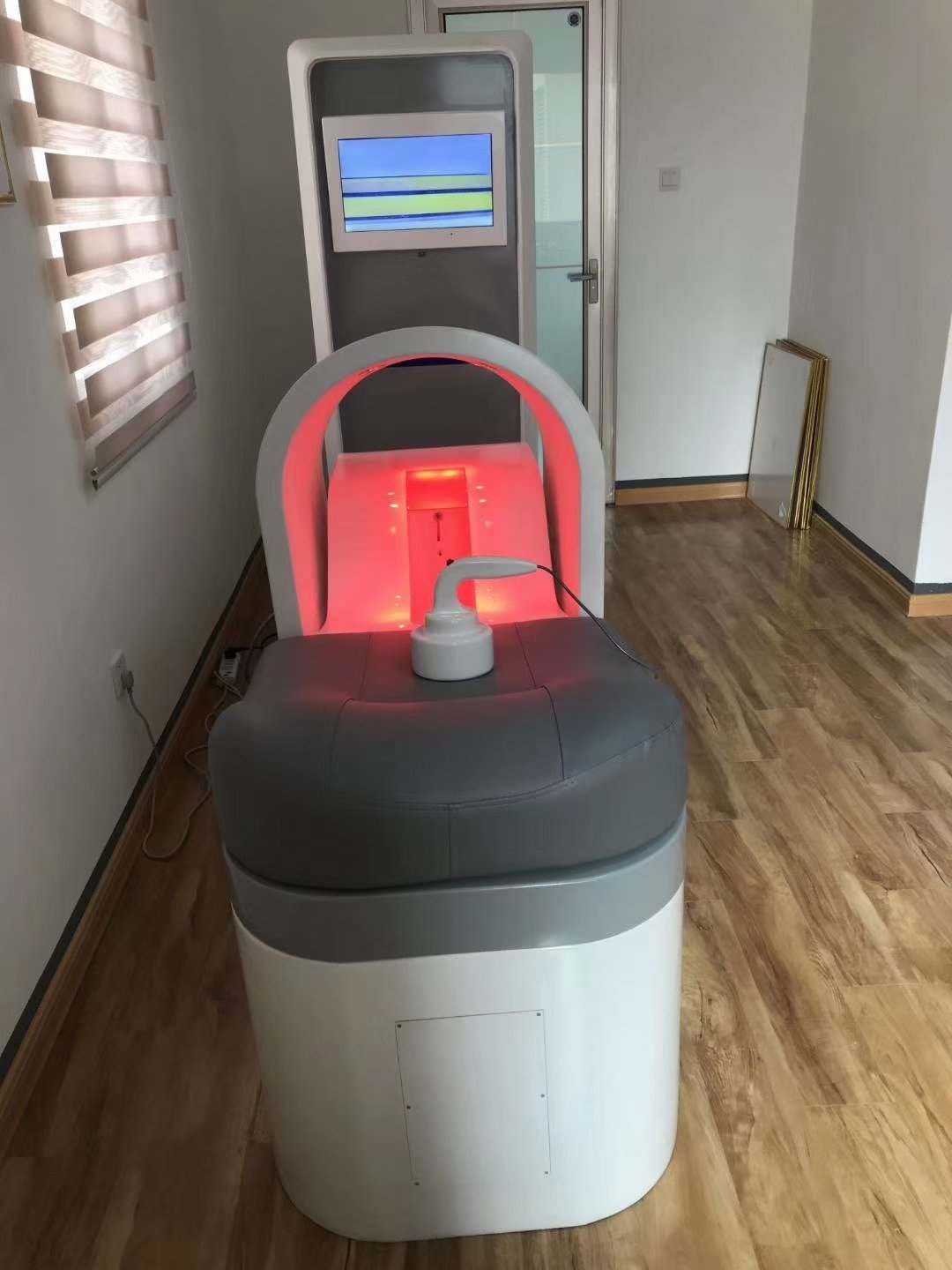 Modern closed system colonic hydrotherapy machine in professional clinic setting