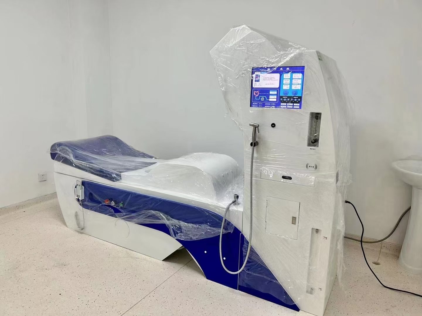 Colon hydrotherapy practitioner training session with colonic machine